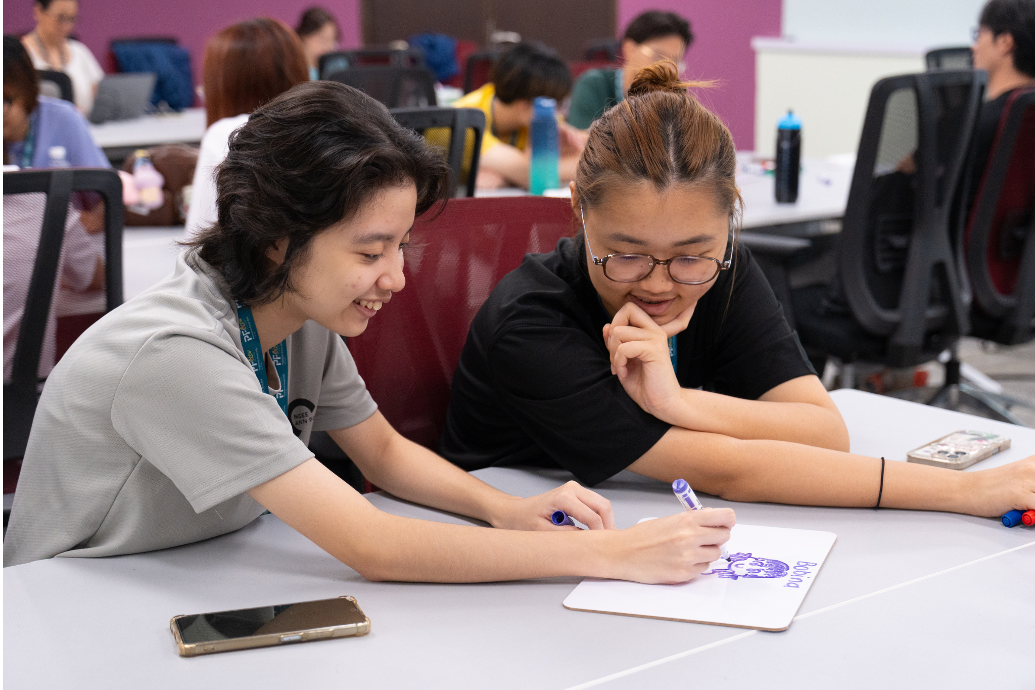 Student delegates collaborate in a group discussion during the WeHiro simulation activity.